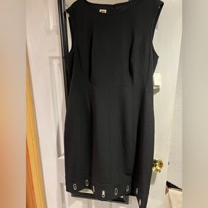 Beautiful Anne Klein black dress with grommets on bottom